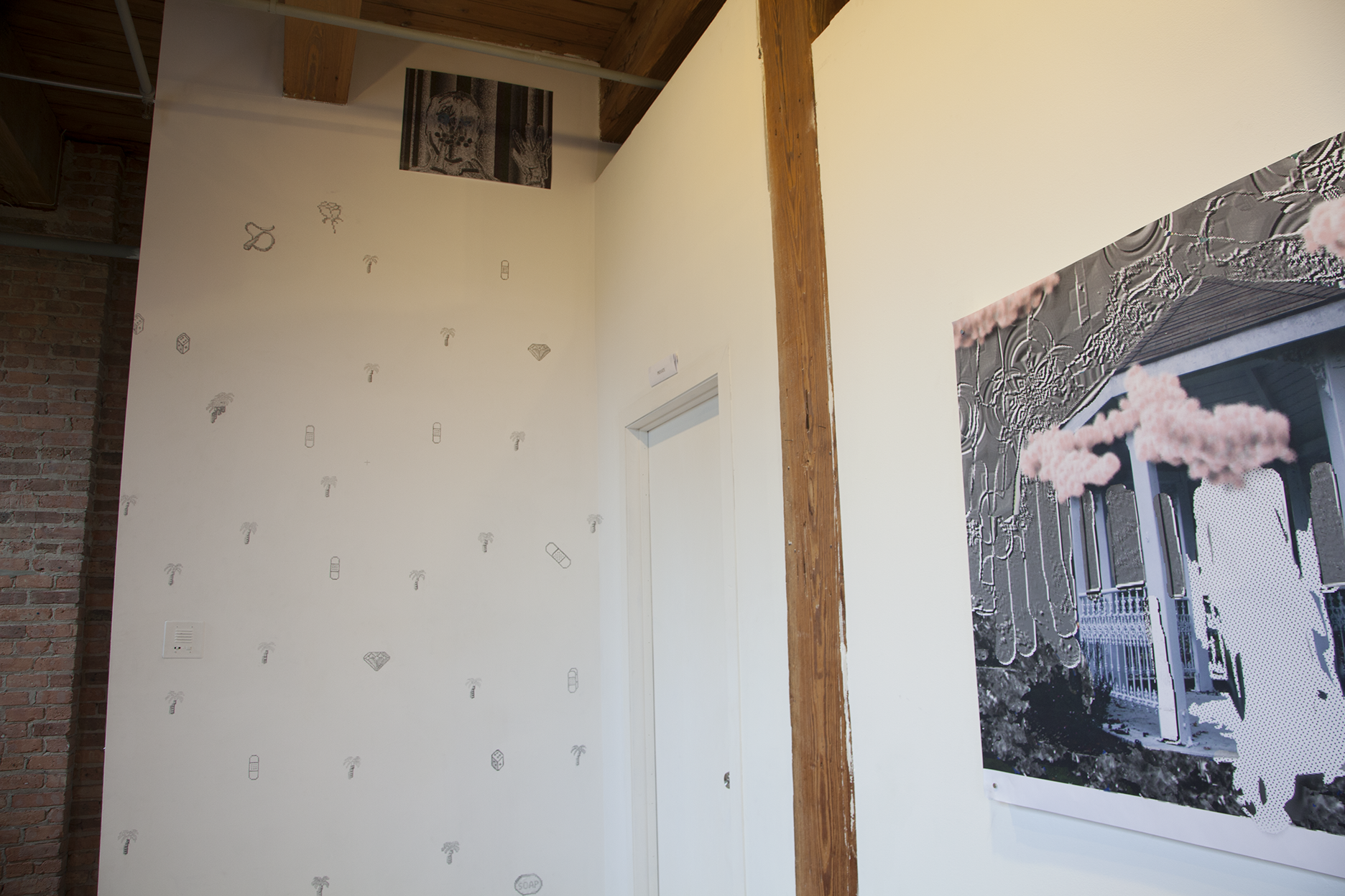 Detail shot of Kidpix graphics drawn in pencil on white walls